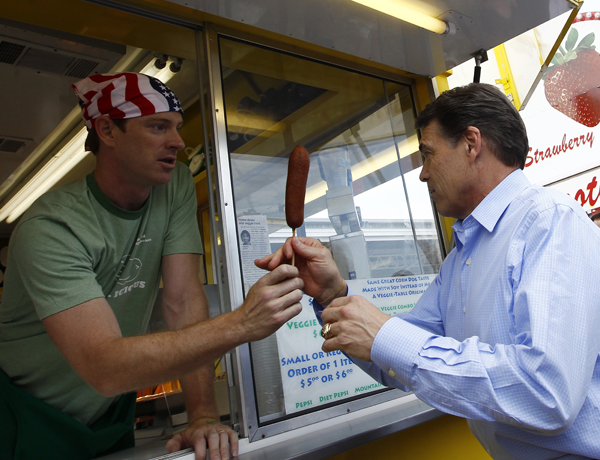 Rick Perry taking a corn dog Rick Perry 1